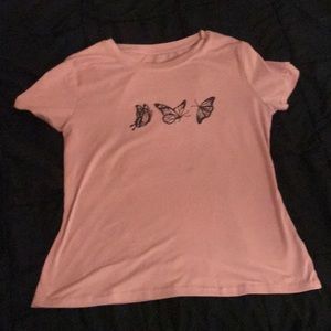 a light pink t-shirt with three butterflies going on the top  from shein